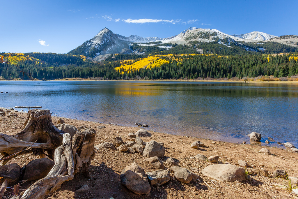 Lost lake with a scenic background of fall mountains.