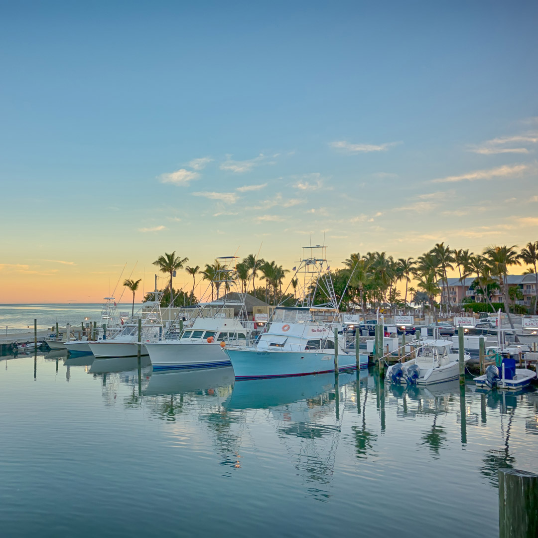 sunset over fishing boats in key largo