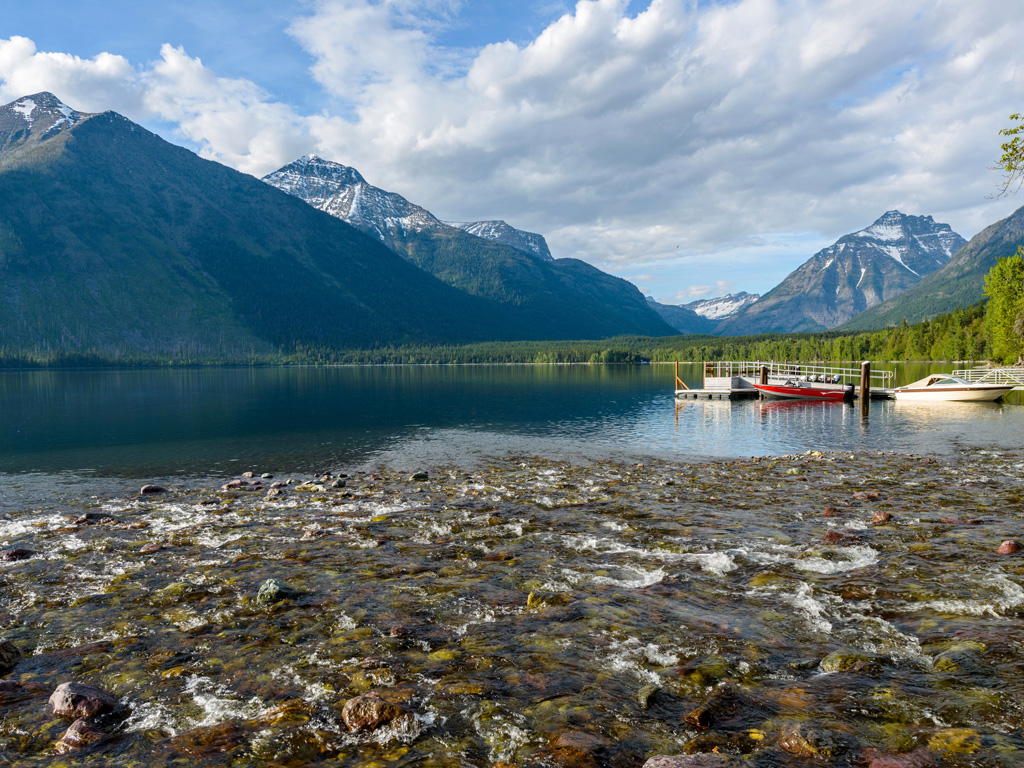 serene lake mcdonald surrounded by mountains