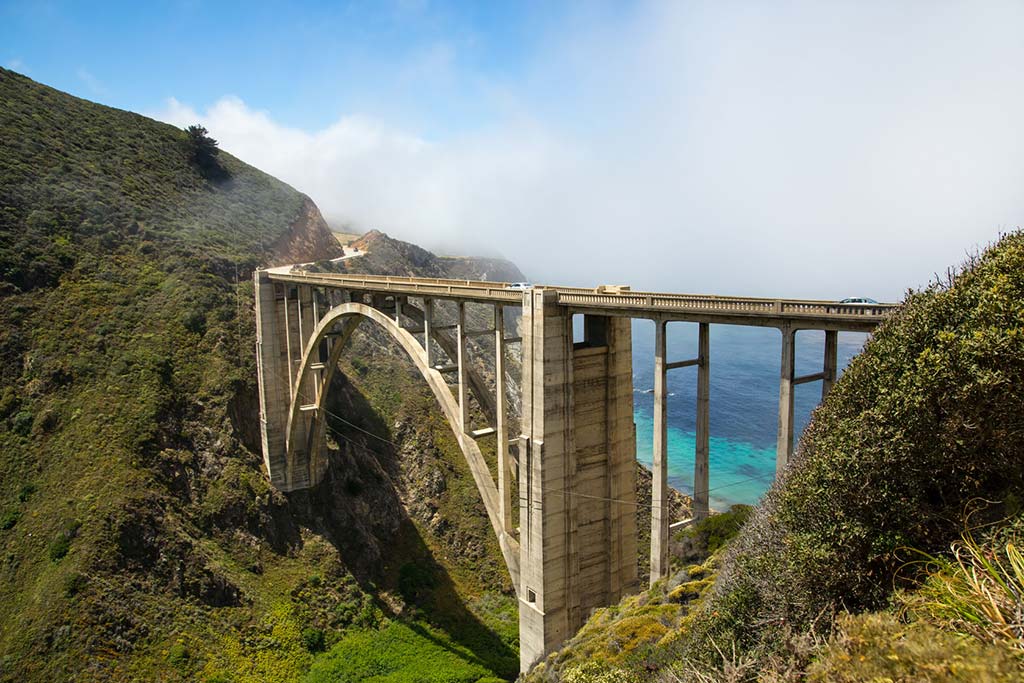 coastal fog wafting toward the bixby bridge