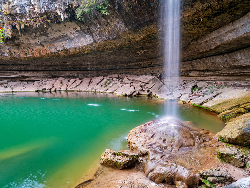 waterfall into the natural pool at Hamilton Pool Preserve in Texas