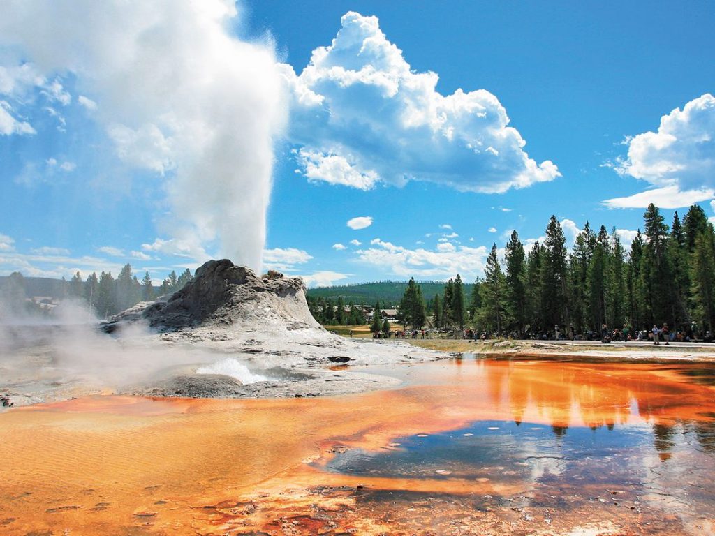 steam shooting into the air from a geyser