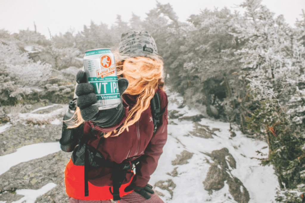 Hiker holding beer